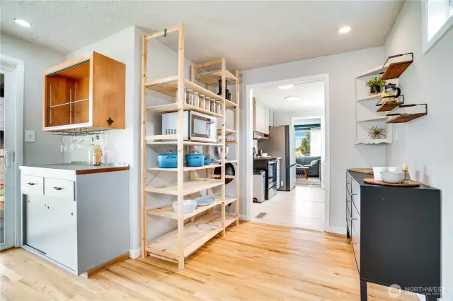 No shortage of storage in this house. From charming built-in shelves and the wine bar to newly added open storage for dried goods and larger cookware.