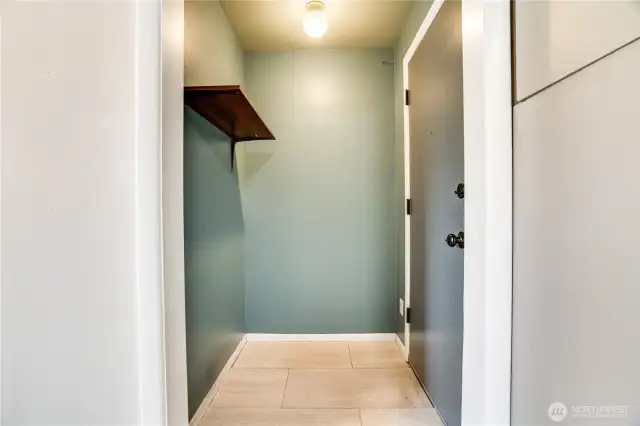 This mud room off the backyard entry door is perfect to hang backpacks, muddy shoes and easily transport groceries to the kitchen!