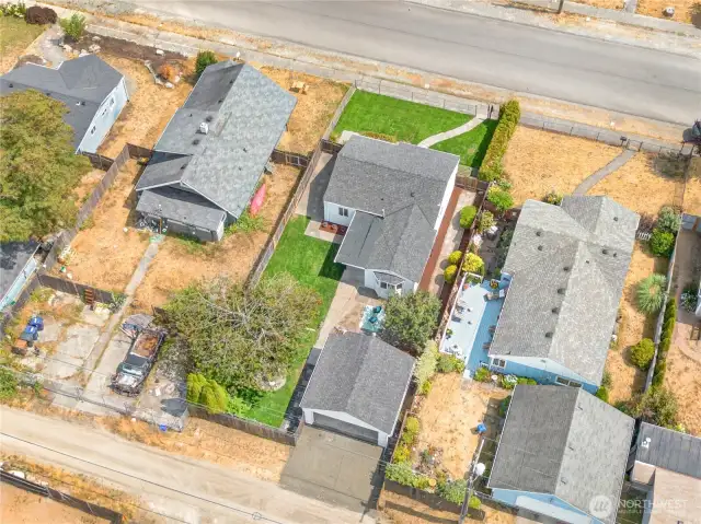 Relish in being the greenest yard on the block! This lot (and home) live larger than they seem, you'll want to experience it in person to fully understand!