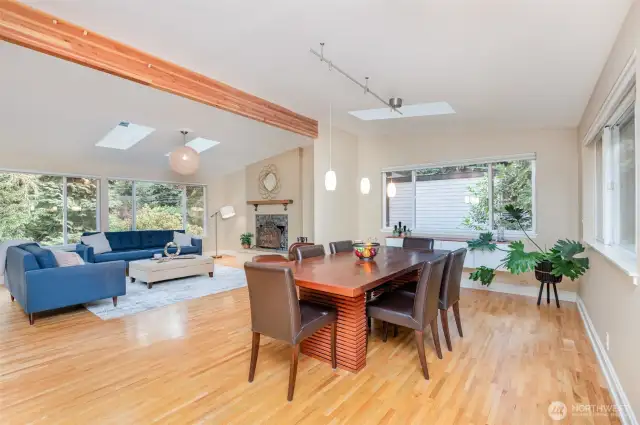 Spacious dining area with slider leading to expansive deck and landscaped backyard.