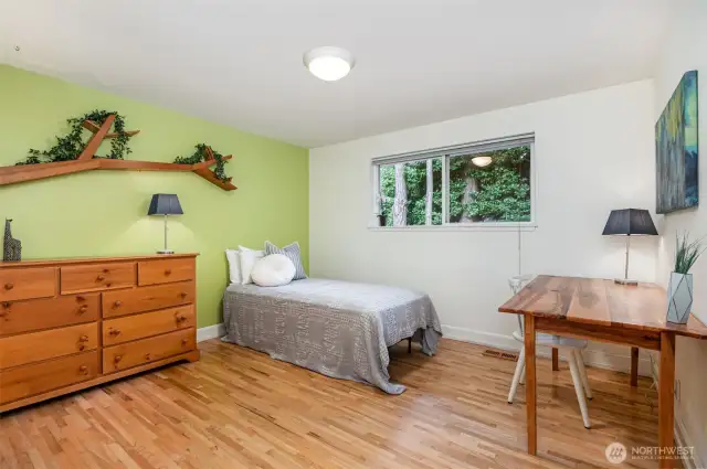 One of two generously sized guest bedrooms on main level