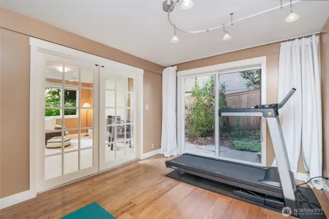 Slider in fifth bedroom for easy access to outside patio with firepit.