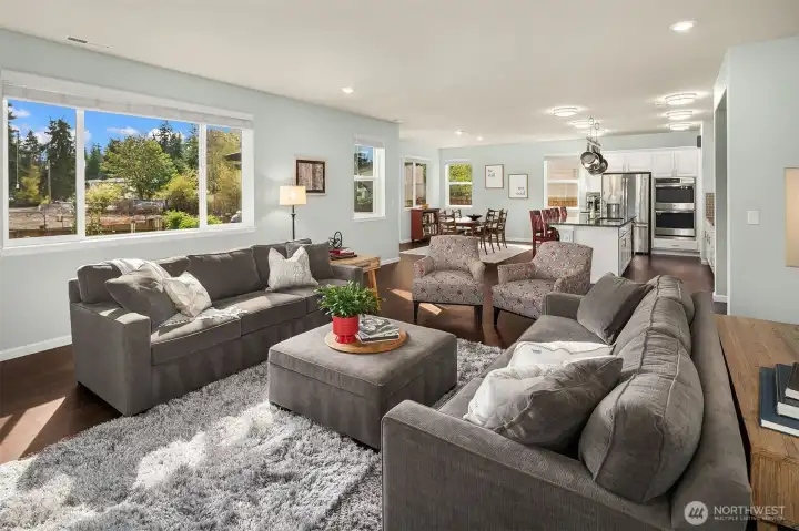 Great room concept with large picture windows to the back yard.