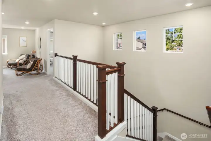 Open loft type bonus room. Everything feels open and airy in this home.  Great light!