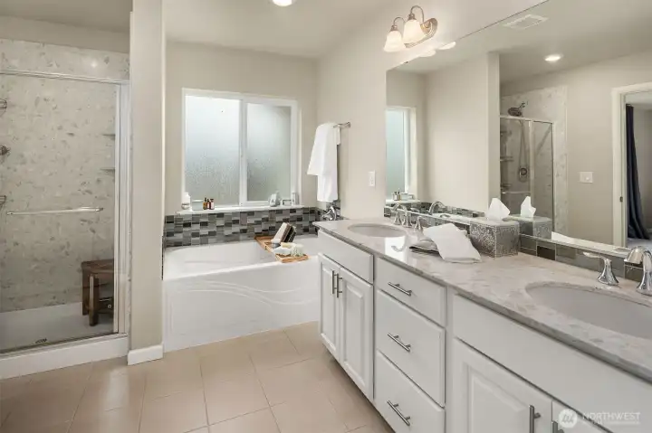 Beautiful five piece primary bath, all tile and quartz.