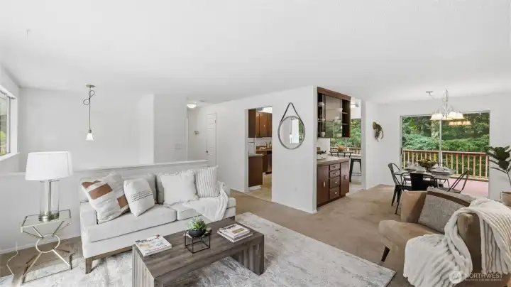 Seamless connection between living, dining, and kitchen spaces creates an inviting flow for gatherings and everyday living