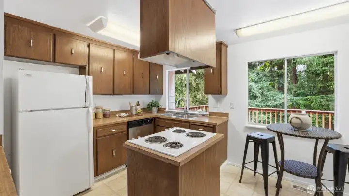 Surrounded by nature, this bright kitchen offers a tranquil setting for your daily routines.