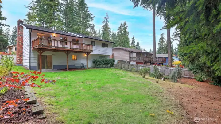 Soak in the peaceful surroundings from your private deck or enjoy the open lawn below for play and entertaining.