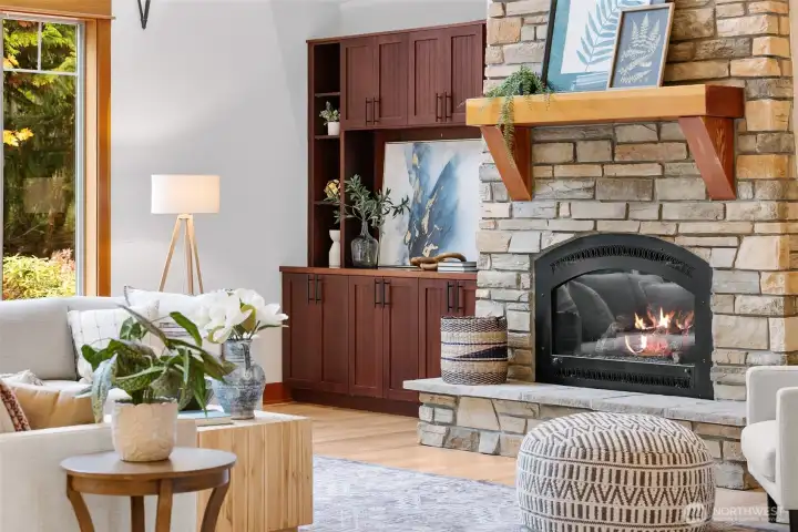 Statement propane fireplace framed with built in shelving
