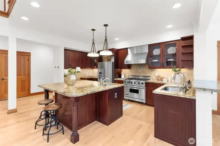 Chef inspired Kitchen with Viking Stove, wine refrigerator, and prep sink