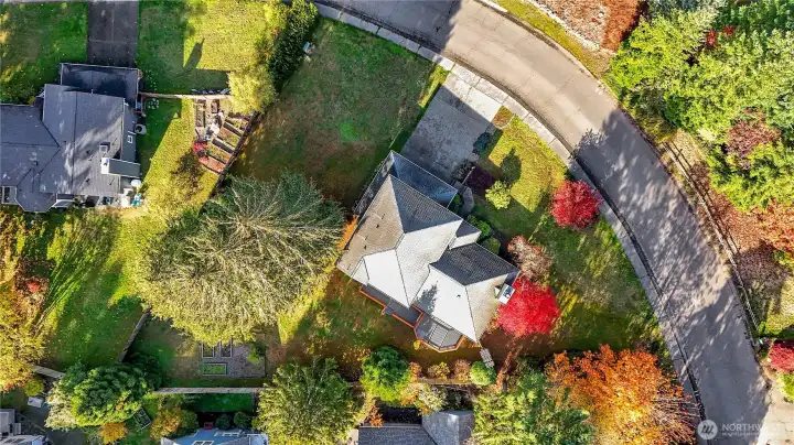 A drone view if the property. Note the fencing in the back yard, perfect for keeping out the deer and keeping in the pets.