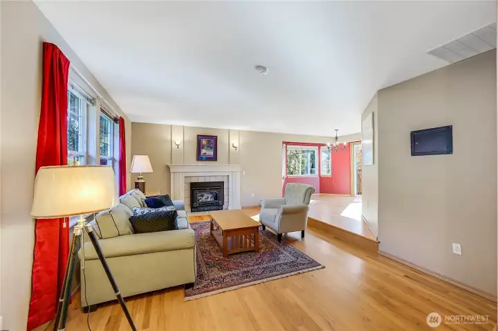 Enter the front door to the sunken living room with real hardwood floors and a cozy propane fireplace to warm your fall evenings.