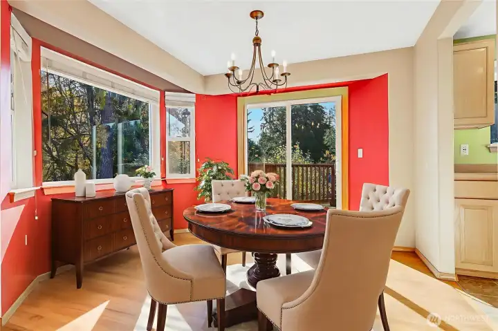 The large bay window basks the dining area in sunshine, plus the peaceful views of the gardens are lovely. The sliding door leads out to the weather-resistant deck.