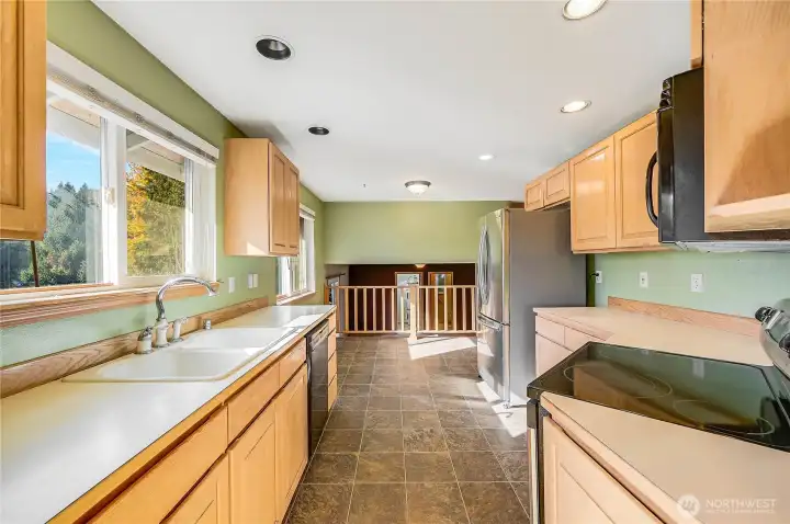 The galley-style kitchen is fully functional and it has great west-facing views over the deck and back yard.