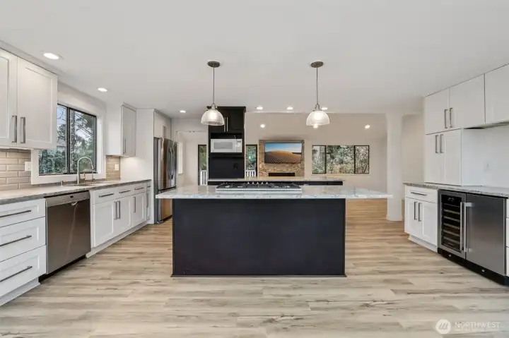 Kitchen with windows to your back, quartz and updated appliances