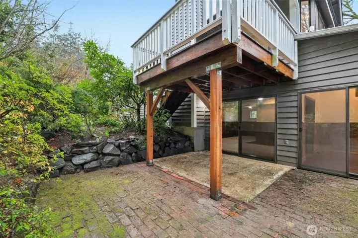 Back deck off entrance to dining room from wooded area