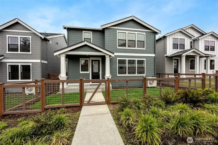 Fully fenced yard with a gate opens to community walking path. Photo is representational. Actual home is under construction and finishes and paint colors may vary. See site agent for details.... Fully fenced yard with a gate opens to community walking path. Photo is representational. Actual home is under construction and finishes and paint colors may vary. See site agent for details....