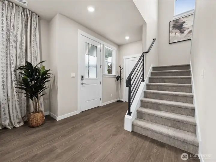 Front entry area with open metal railings. Photo is representational. Actual home is under construction and finishes and paint colors may vary. See site agent for details....