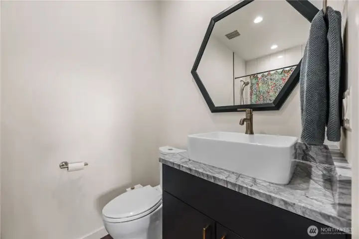Full bathroom next to bedrooms (across house from primary)