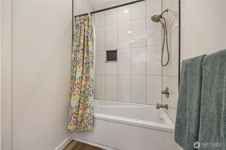 Full bathroom next to bedrooms (across house from primary)