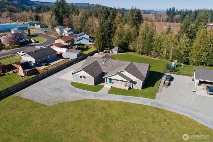 Expansive 1.19 acre property with room for RVs, toys, and outdoor living.