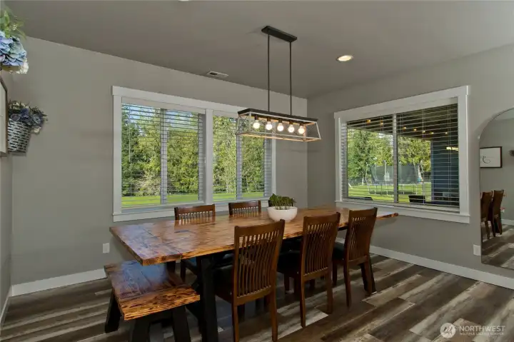 Dining area with large windows and natural light.