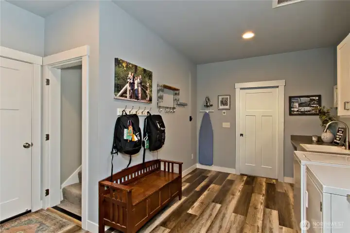 Utility room with access to upstairs bonus room.
