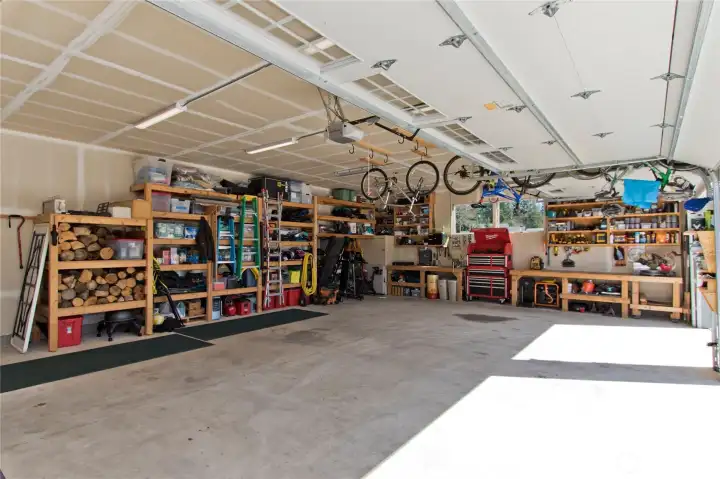 1,120 Sq ft 3-car garage with workshop space and abundant storage.