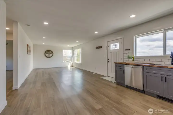 Open floor plan with easy flow between kitchen and living room