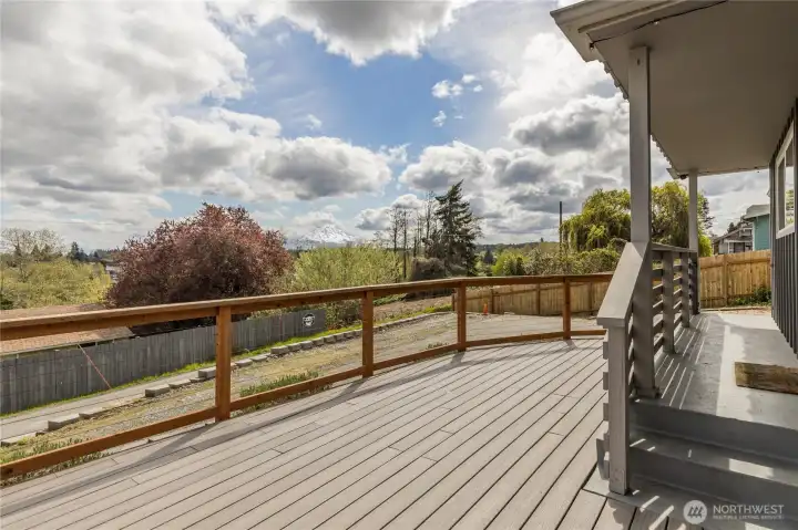 Morning coffee with a view! The expansive front deck offers the perfect vantage point to watch the sunrise over Mt. Rainier and the valley below.