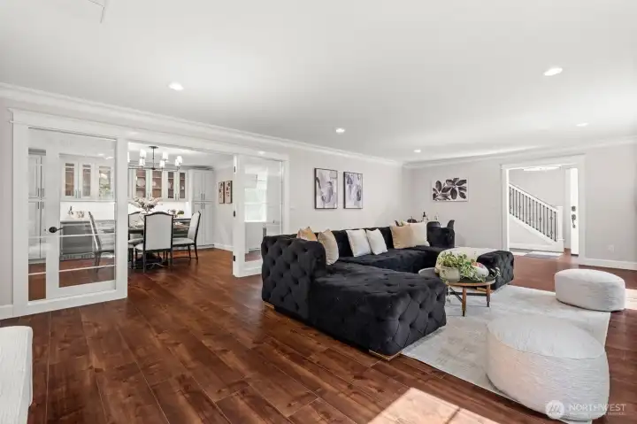 Great room with television mounted above the fireplace