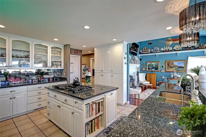5-burner gas stove with granite benchtops all around