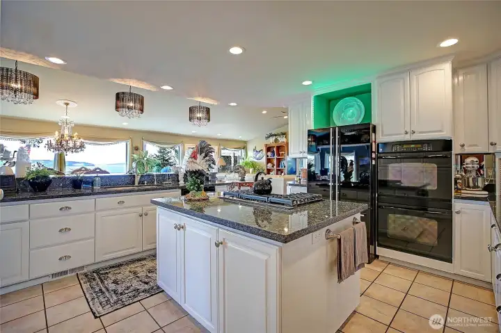 Kitchen island with 5-burner stove top.