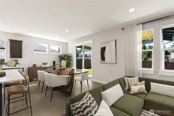 Virtual staging. Open plan living/dining/kitchen.  Photos are for representation purposes only