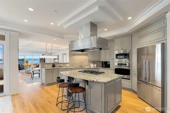 Designed for both everyday living and entertaining, the chef's kitchen anchors the home and opens to the dining area and casual living room, where sweeping views provide a beautiful backdrop. Designed for both everyday living and entertaining, the chef's kitchen anchors the home and opens to the dining area and casual living room, where sweeping views provide a beautiful backdrop.