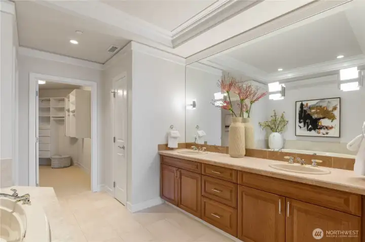 Primary bath featuring a soaking tub, double vanity, walk-in shower, and walk-in closet. Primary bath featuring a soaking tub, double vanity, walk-in shower, and walk-in closet.