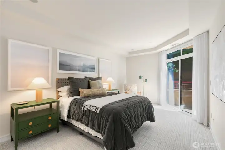 Comfortable second or guest bedroom featuring a covered patio, ensuite bath, and walk-in closet. Comfortable second or guest bedroom featuring a covered patio, ensuite bath, and walk-in closet.