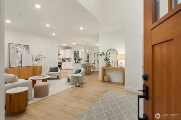 High ceilings and abundant natural light flood the open-concept living area. High ceilings and abundant natural light flood the open-concept living area.