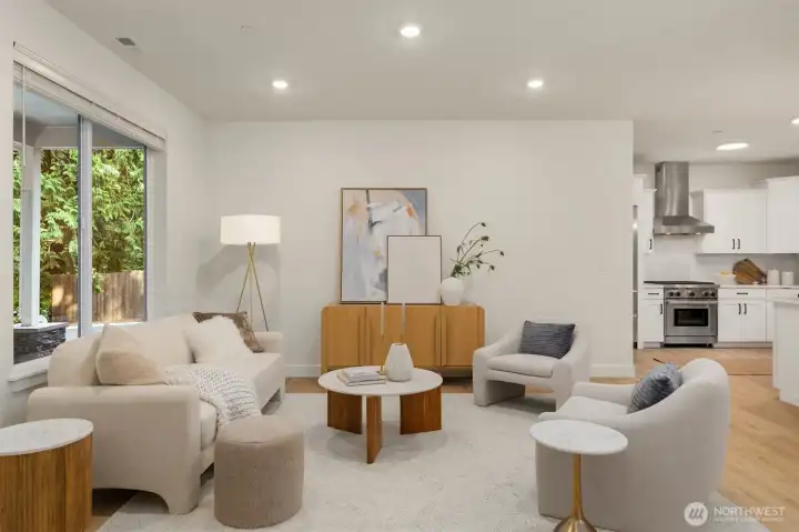 The spacious living area overlooks the front yard providing a peaceful backdrop. The spacious living area overlooks the front yard providing a peaceful backdrop.