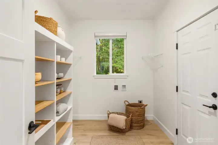 Just off the kitchen, the spacious walk-in pantry offers exceptional storage options (bring your design ideas!) and includes a designated space for a future washer and dryer. This functional area also provides convenient direct access to the attached garage. Just off the kitchen, the spacious walk-in pantry offers exceptional storage options (bring your design ideas!) and includes a designated space for a future washer and dryer. This functional area also provides convenient direct access to the attached garage.
