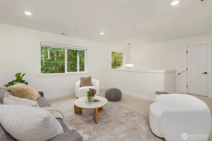 The upstairs loft provides a separate living area perfect for a media room, play space, home office, or additional gathering area. The upstairs loft provides a separate living area perfect for a media room, play space, home office, or additional gathering area.