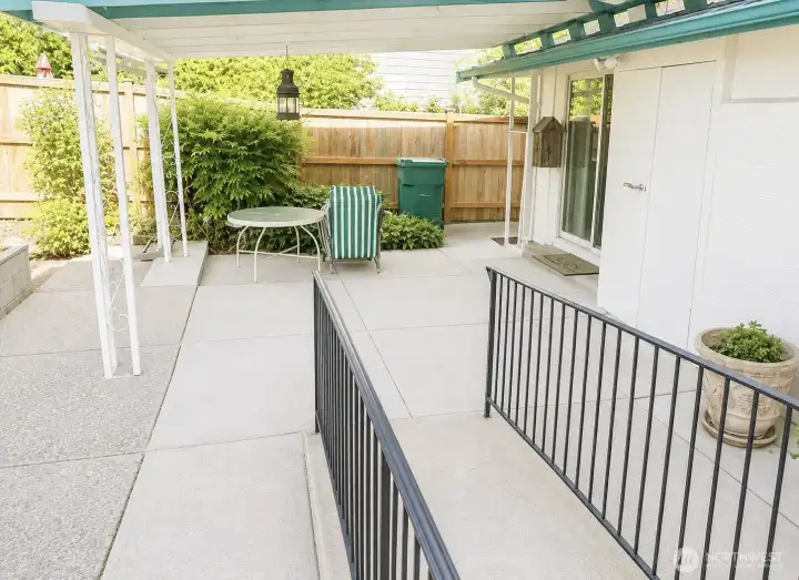 Covered, private patio with fully fenced yard.