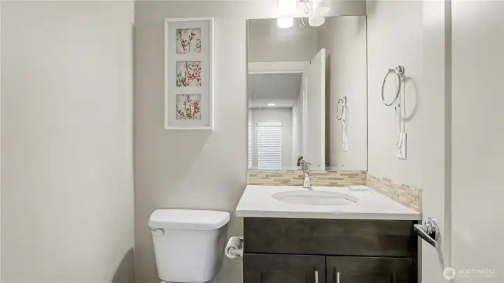 Main floor half bathroom, perfect for guests.
