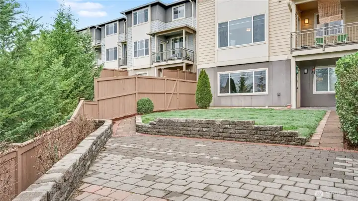 Paver patio and path around yard for extra charm.