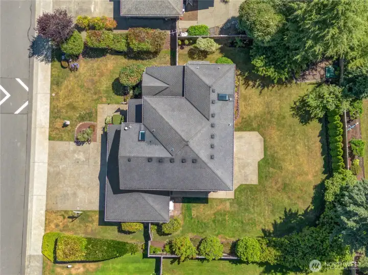 From above, you'll appreciate the generous homesite with mature landscaping, expansive lawn space, and a private backyard designed for both relaxation and outdoor enjoyment.