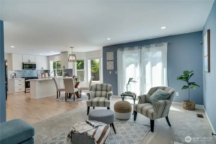 The open-concept design keeps everyone connected, while Milgard French doors installed in 2022 invite natural light inside and provide easy access to the backyard.