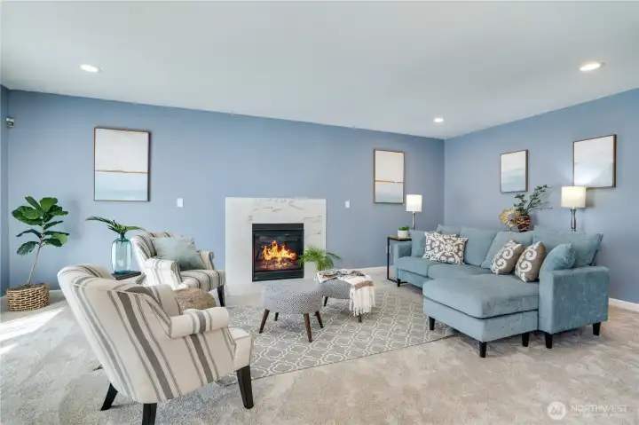 Anchored by a cozy gas fireplace, the spacious family room offers a comfortable place to unwind, with new carpet and refreshed baseboards completing the updated look.
