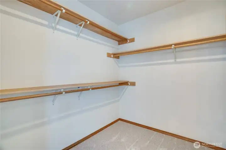 A generous walk-in closet provides exceptional storage with room to organize clothing, shoes, and seasonal essentials.