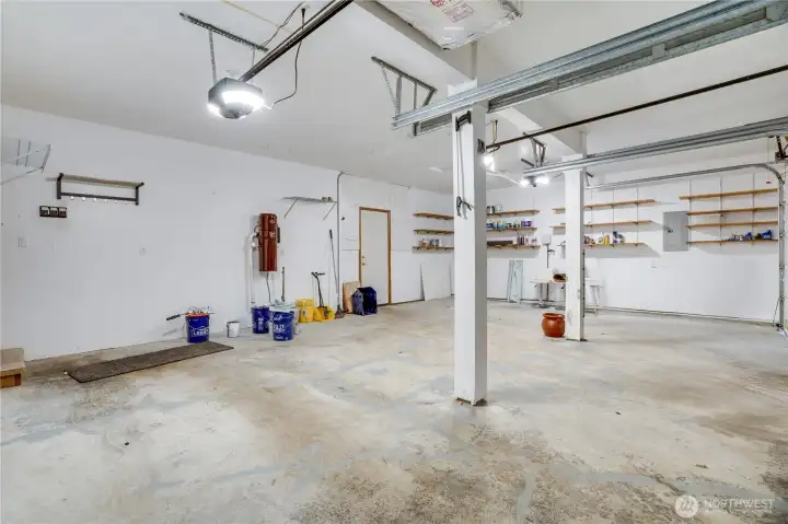 The oversized three-car garage offers outstanding flexibility for vehicles, hobbies, workshop space, and abundant organized storage.