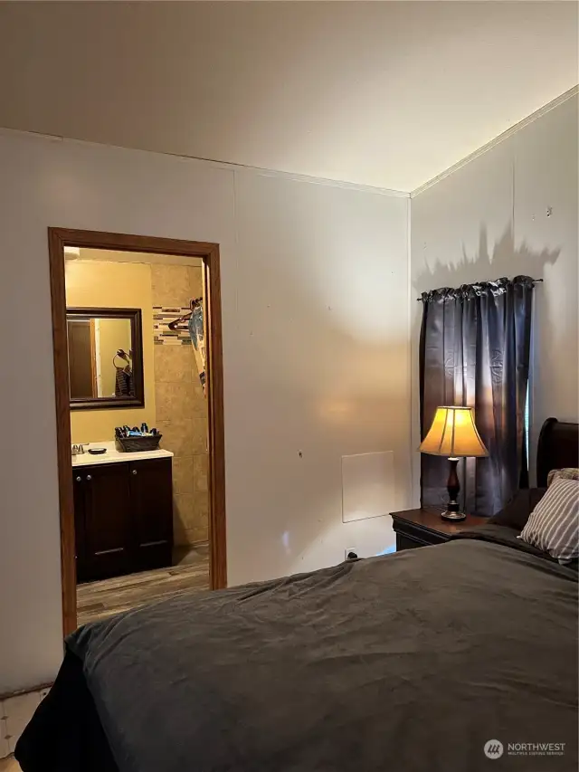 Vaulted ceilings, two windows, and closet.